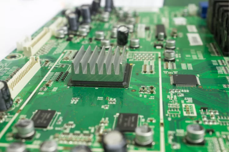 Small heat sink mounted on a circuit board for cooling high-density electronic components.